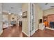 Open-concept living area with hardwood floors, staircase, view into office, and neutral color palette at 1356 Coralstone Dr, Celebration, FL 34747