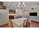 Open concept living area with dining table, kitchen and seating area at 1356 Coralstone Dr, Celebration, FL 34747