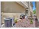 View of the outdoor patio with grill, table and seating, and AC unit at 1356 Coralstone Dr, Celebration, FL 34747