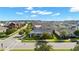 Stunning aerial view of the two-story home with landscaped yard in a beautiful residential neighborhood at 13661 Granger Ave, Orlando, FL 32827