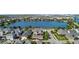 An aerial view of a well-maintained neighborhood with a lake and plenty of green space at 13661 Granger Ave, Orlando, FL 32827