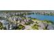 Beautiful aerial view of homes near a lake surrounded by lush trees and greenery in a well-planned community at 13661 Granger Ave, Orlando, FL 32827