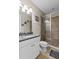 Contemporary bathroom with white vanity, granite countertop, tiled shower, and modern fixtures at 13661 Granger Ave, Orlando, FL 32827