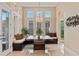 Bright dining room featuring custom built-in seating, and views of the pool and backyard at 13661 Granger Ave, Orlando, FL 32827
