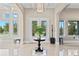 Bright foyer featuring tile floors, high ceilings, and views to the lake at 13661 Granger Ave, Orlando, FL 32827