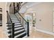 Grand foyer featuring staircase, hardwood floors, arched doorways and abundant natural light at 13661 Granger Ave, Orlando, FL 32827
