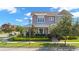 Charming two-story home boasts manicured landscaping, a metal roof and a welcoming front porch at 13661 Granger Ave, Orlando, FL 32827