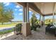 Inviting front porch with comfortable seating and view of the lake at 13661 Granger Ave, Orlando, FL 32827