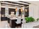 Spacious kitchen with dark wood cabinets, large islands, granite countertops, and stainless steel appliances at 13661 Granger Ave, Orlando, FL 32827