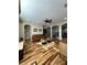 Inviting living room featuring hardwood floors, a ceiling fan, comfortable leather sofa, and two stylish accent tables at 13661 Granger Ave, Orlando, FL 32827