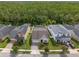 Beautiful aerial view of the home surrounded by lush greenery and neighboring houses at 14072 Alafaya Oak Bnd, Orlando, FL 32828