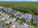 Aerial shot of neighborhood highlighting this house with lush landscaping, great location at 14072 Alafaya Oak Bnd, Orlando, FL 32828