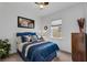 Cozy bedroom features ample natural light, comfortable furnishings, and simple decor, creating a peaceful and inviting atmosphere at 14072 Alafaya Oak Bnd, Orlando, FL 32828