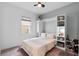 Bright and airy bedroom features a cozy bed, built-in shelving and murphy bed, perfect for guests or relaxation at 14072 Alafaya Oak Bnd, Orlando, FL 32828