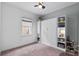 Clean and spacious bedroom with a built-in murphy bed and shelving, offering flexible space for guests or hobbies at 14072 Alafaya Oak Bnd, Orlando, FL 32828