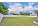 This is a view of the expansive backyard with a well-maintained lawn and a white privacy fence at 150 Tarpon Cir, Winter Springs, FL 32708