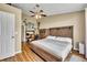Spacious bedroom features a king-size bed, a desk, and artwork, providing a relaxing and functional space at 150 Tarpon Cir, Winter Springs, FL 32708