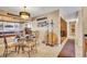 Charming dining room illuminated by a chandelier, complemented by Gathering photos and unique decor at 150 Tarpon Cir, Winter Springs, FL 32708