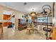 Elegant dining room with decorative lighting, a glass-top table, and stylish seating, perfect for entertaining guests at 150 Tarpon Cir, Winter Springs, FL 32708