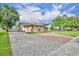 Charming home featuring a large two-car garage and patterned brick driveway, adding curb appeal to the property at 150 Tarpon Cir, Winter Springs, FL 32708