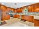 Well-lit kitchen featuring granite countertops, stainless steel appliances, and custom cabinetry at 150 Tarpon Cir, Winter Springs, FL 32708