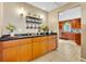 Convenient butler's pantry boasts ample cabinet space and a sleek countertop, with an adjoining kitchen area visible at 150 Tarpon Cir, Winter Springs, FL 32708