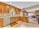 Spacious kitchen featuring granite countertops, stainless steel appliances, and open layout at 150 Tarpon Cir, Winter Springs, FL 32708