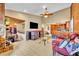 Open living area featuring high ceilings and a view to the kitchen and dining area at 150 Tarpon Cir, Winter Springs, FL 32708