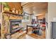 Charming fireplace with stone surround, a wood-paneled ceiling, and ample natural light from nearby windows at 150 Tarpon Cir, Winter Springs, FL 32708