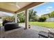 Back porch featuring an inflatable hot tub, brick pavers, and a landscaped backyard at 1501 Prairie Oaks Dr, St Cloud, FL 34771