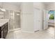 Bright bathroom featuring a walk-in shower with glass door at 1501 Prairie Oaks Dr, St Cloud, FL 34771