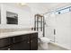 Bright bathroom features a vanity with granite countertop, a toilet and shower at 1501 Prairie Oaks Dr, St Cloud, FL 34771