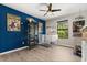 Unique bedroom with custom artwork, shelving display case, and modern furniture at 1501 Prairie Oaks Dr, St Cloud, FL 34771