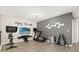 Home gym equipped with exercise bike, treadmill, and weight rack, perfect for workouts at 1501 Prairie Oaks Dr, St Cloud, FL 34771