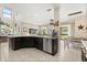 Open-concept kitchen with granite countertops and stainless steel appliances at 1501 Prairie Oaks Dr, St Cloud, FL 34771