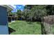 Expansive backyard with lush lawn and mature trees, offering privacy and space for outdoor activities at 1507 Sw 4Th St, Ocala, FL 34471
