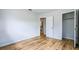 Clean bedroom with wood-look flooring and easy access to the bathroom and closet at 1507 Sw 4Th St, Ocala, FL 34471
