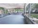 Enclosed patio with a view of the backyard featuring concrete flooring and lots of light at 1507 Sw 4Th St, Ocala, FL 34471