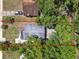 Aerial view showing the roof of a single-story home with mature trees and a yard outlined in red at 1906 S Summerlin Ave, Sanford, FL 32771
