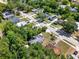 This aerial view shows the street, houses and mature trees in a residential neighborhood at 1906 S Summerlin Ave, Sanford, FL 32771