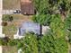 Overhead view of a residence showing the roof and surrounding trees providing privacy from above in this aerial perspective at 1906 S Summerlin Ave, Sanford, FL 32771