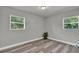Bright bedroom with hard surface floors, neutral paint, and natural light at 1906 S Summerlin Ave, Sanford, FL 32771