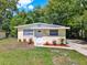 Attractive single story home with a well-manicured lawn and colorful landscaping at 1906 S Summerlin Ave, Sanford, FL 32771