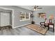 Cozy living room featuring hard surface floors, neutral paint, and natural light at 1906 S Summerlin Ave, Sanford, FL 32771