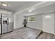 This is a living area showing the entrance door and stainless fridge at 1906 S Summerlin Ave, Sanford, FL 32771