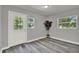 Bright room with hard surface floors, neutral paint, and natural light at 1906 S Summerlin Ave, Sanford, FL 32771