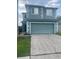 Two-story home with a two-car garage and well-maintained lawn at 1921 Stone Abbey Blvd, Orlando, FL 32828