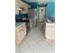 Galley-style kitchen features stainless steel appliances and ample cabinet space at 1921 Stone Abbey Blvd, Orlando, FL 32828