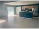 Open-concept kitchen and living area with tile floors and stainless steel appliances at 1921 Stone Abbey Blvd, Orlando, FL 32828