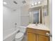 Clean bathroom with a white tiled shower, vanity, and modern fixtures at 1948 Conway Rd # 8, Orlando, FL 32812